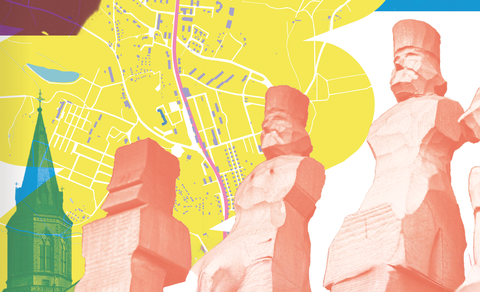 Bild mit Schnitzfiguren und einem Stadtplan von JGS