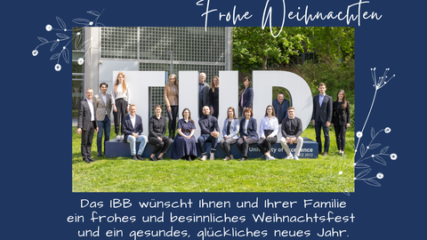 Gruppenbild der Mitarbeiter von dem Institut für Baubetriebswesen mit Weihnachtswünschen