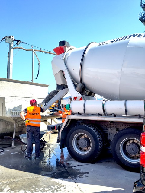 Concrete delivery from the truck mixer in the ready-mix concrete plant