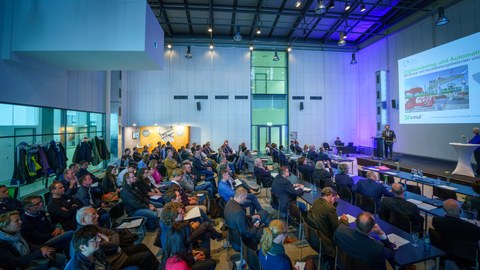 Photo shows the fully occupied conference room at the simul Carbon Reinforced Concrete Expert Forum in the German Hygiene Museum Dresden
