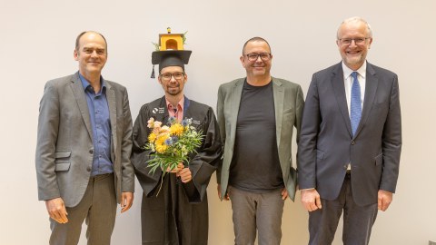 Conrad Pelka und die anwesende Promotionskommission