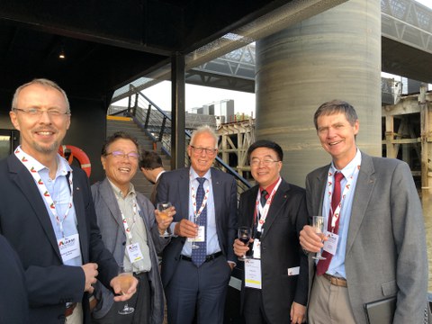 Welcome-Reception der Französischen Gruppe der IABSE auf der Nantilus (Nantes, Loire) am 18. September 2018 – Gratulation zur Wahl des Präsidenten der IABSE an Prof. Yaojun Ge (v. l. n. r.: Prof. Richard Stroetmann, Technische Universität Dresden; Prof. Y