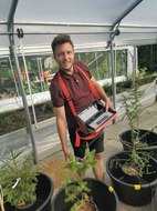 V. Riedel in the greenhouse
