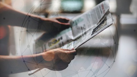 man reading newspaper