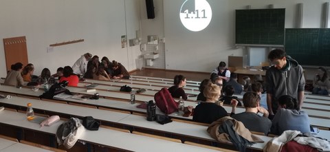 Lecture hall with groups of people