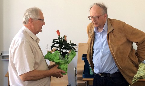 Prof. Gräber (left) receiving congratulations from Prof. Liedl (right)