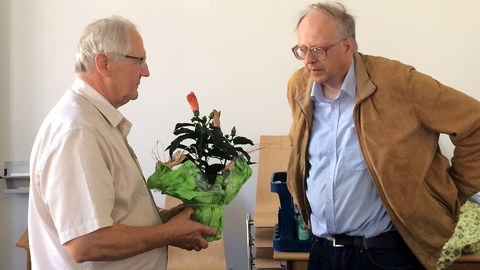 Prof. Gräber (left) receiving congratulations from Prof. Liedl (right)