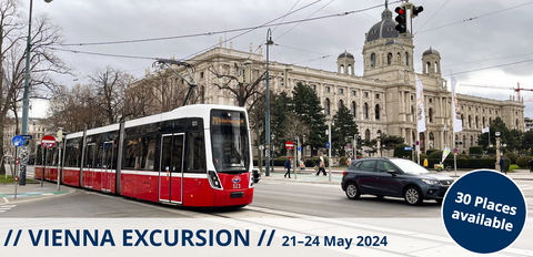 This picture shows a street in Vienna with a tram.