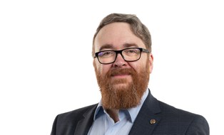 Portrait of a man with beard and glases