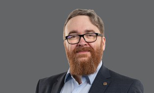 Portrait of a man with beard and glases