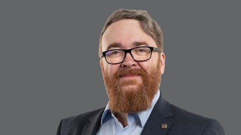 Portrait of a man with beard and glases