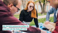 A female student and two male students sit on a blanket on a lawn in a circle and look at a paper sketch in the middle. One caption writes: "As a transportation scientist:in, I help shape the future!"