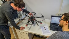 Data acquisition with drones at desk with laptop