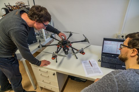 Data acquisition with drones at desk with laptop