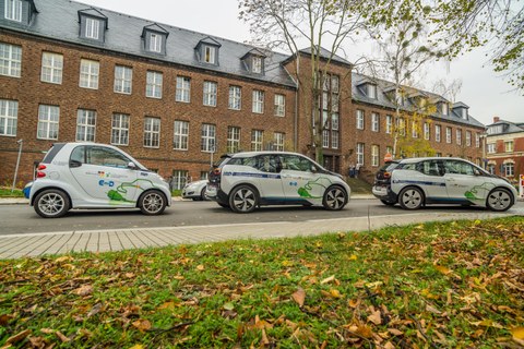 three Electric cars in front of the Dresden Institute of Automobile Engineering
