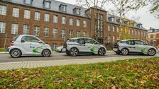 three Electric cars in front of the Dresden Institute of Automobile Engineering