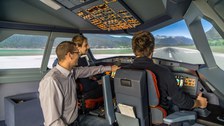Airbus A320 Research Simulator; three people in the cockpit at takeoff