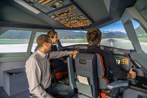 Airbus A320 Research Simulator; three people in the cockpit at takeoff