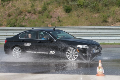 Car driving on wet road at Lausitzring