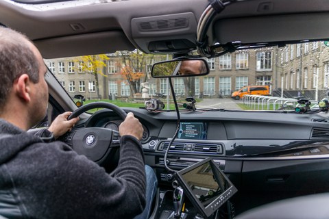 View of the interior with measurement technology and driver at the steering wheel