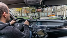 View of the interior with measurement technology and driver at the steering wheel