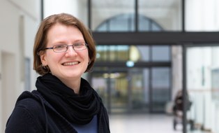 Here is a photo of Birgit Keller. She wears glasses and smiles.