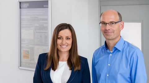 A man and a woman smiling.