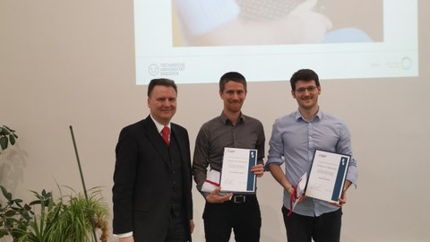 Award ceremony Prof. Hilbert-Prize 2019. Three men in suits, two of them with certificates.