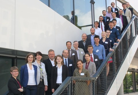 Participants of the doctoral workshop. 26 people stand on a staircase.