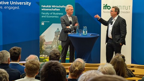 Es sind Prof. Dr. Martin Werding und Prof. Dr. Leßmann zu sehen