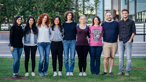 Group standing together in a row, 2020