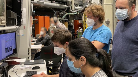 Scientists at synchrotron facility, evaluating beamtime data (2021)