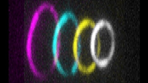 Four colorful rings. Starting from the left, the largest ring is colored in magenta, then a smaller one in cyan, an even smaller one in yellow, and the smallest one in white.