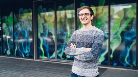 Felix Wagner in front of his picture covering the CRTD door