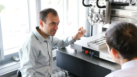 Ivan Minev in front of 3D Printer