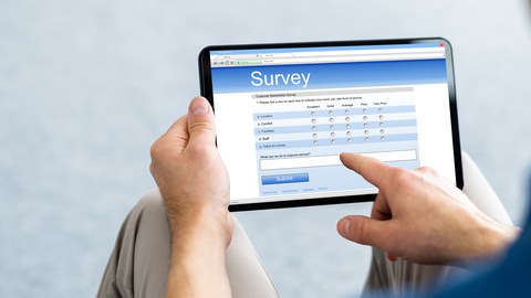 Person completes survey on a tablet.