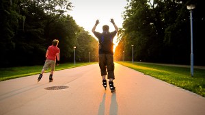 Two persons inline skating