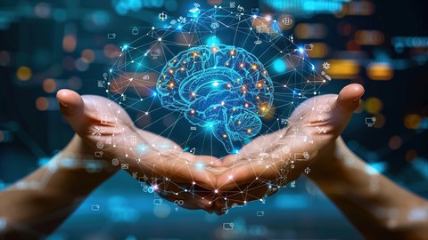 Hände, die ein Hologramm von einem Gehirn mit Verknüpfungen zu verschiedenen Symbolen halten.