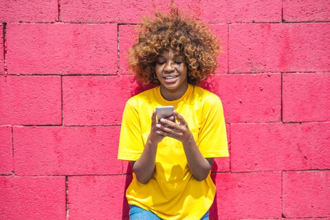 young adult looking at smartphone