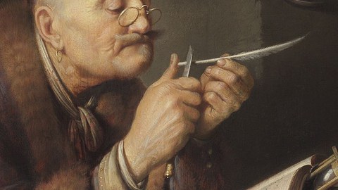 Scholar sharpens his pen.
