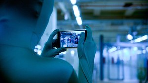 shoulder view over person filming with cell phone