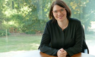 Prof. Kaesling sitting at a table.