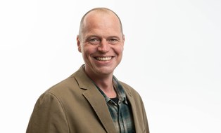 Porträtfoto von Dr. André Tiemann