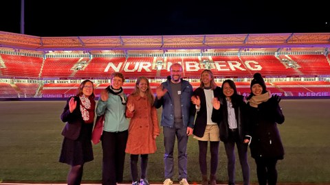 Photo of the team taken at the football stadium in Nuremberg during NaMa conference