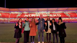 Photo of the team taken at the football stadium in Nuremberg during NaMa conference