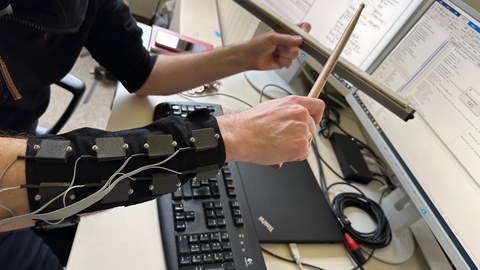 Music interface drumbeam with haptic armband array