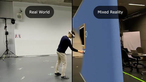 A view into the Worry Gallery, where the virtual and real world are blended. A person reaching from one side (real world) into the mixed realty view.