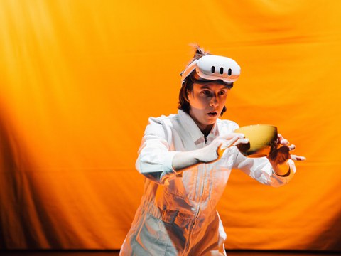 Photo from the theater act: Jeannie with XR-HMD moving surprised a cup.