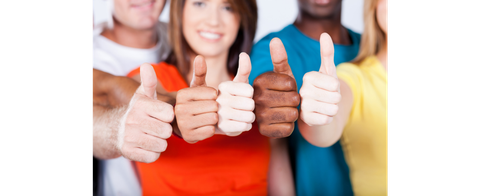 international group of young people give their thumbs up