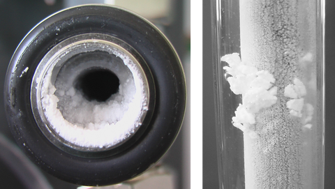 The photo shows zinc borate precipitations at a heated cladding tube (up to 90° C). 